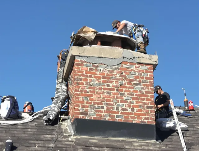 Stallings Chimney Sweep installing a custom chimney crown in Stallings, NC