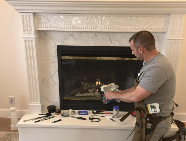 Stallings Chimney Sweep performing fireplace maintenance in Stallings, NC