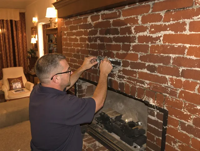 Stallings Chimney Sweep expert fixing a fireplace in Stallings, NC
